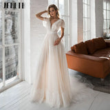 Runhufu Cap Sleeve Boho Wedding Dresses Backless Lace Appliques Beach Bride Gowns Robe De Mari¨¦e Dot Tulle V-Neck Sweep Train