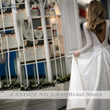 Runhufu NICEB Deep V Neck Shiny Wedding Dresses With Pockets Satin Sweep Train Wedding Gown Glitter Long Sleeve 2023 Bridal Party
