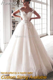 Runhufu Bling Ball Gown Wedding Dresses Nude Tulle Neck Cap Sleeves Lace Applique Corset Buttons Sweep Train Bridal Gowns